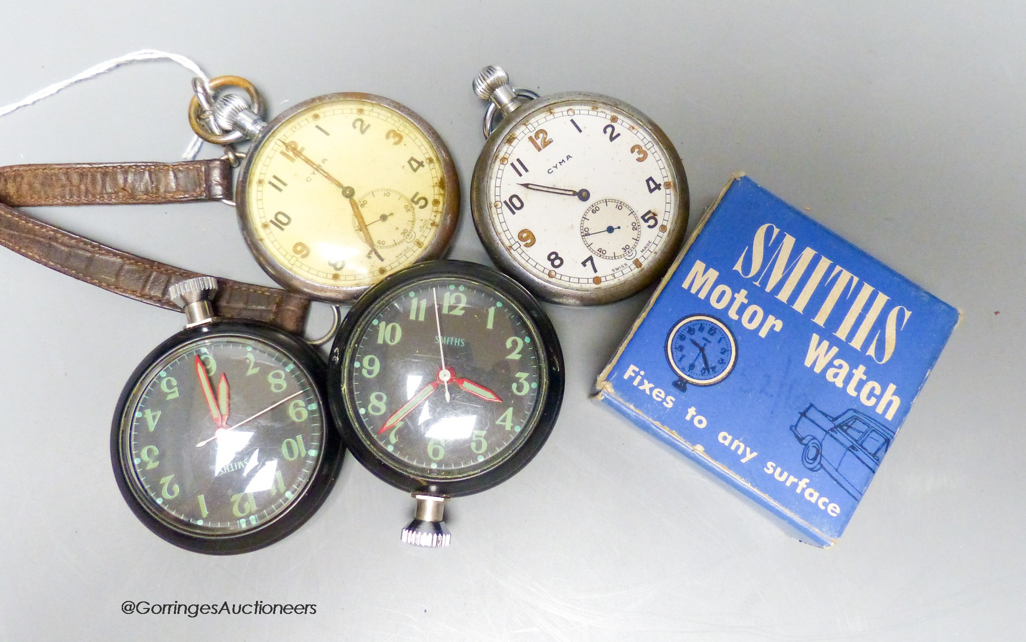 Two Military issue GSTP pocket watches and two Smiths motor watches.